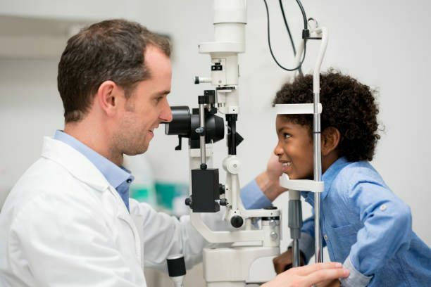 Kid having eyes tested