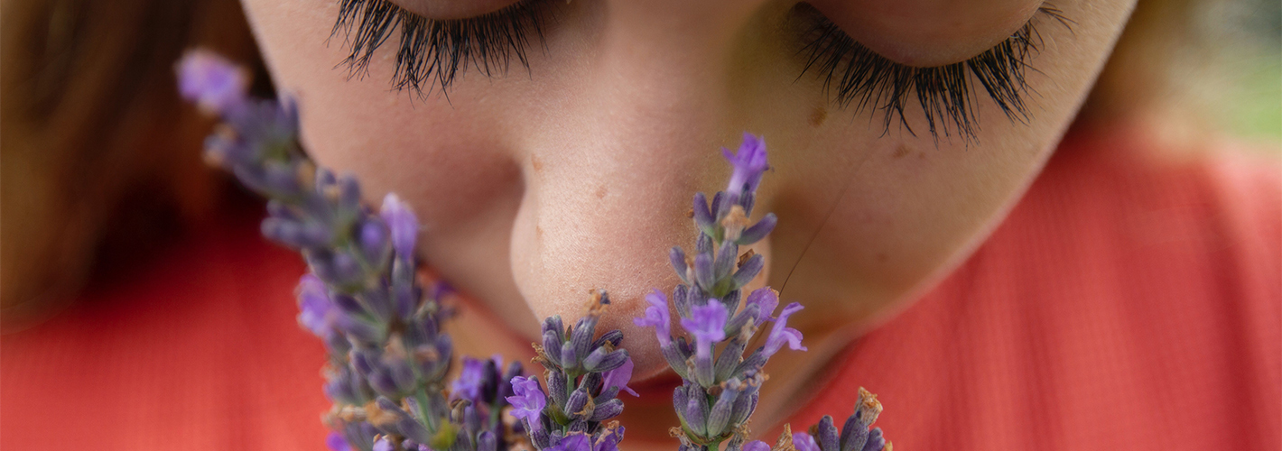 girl smelling flowers